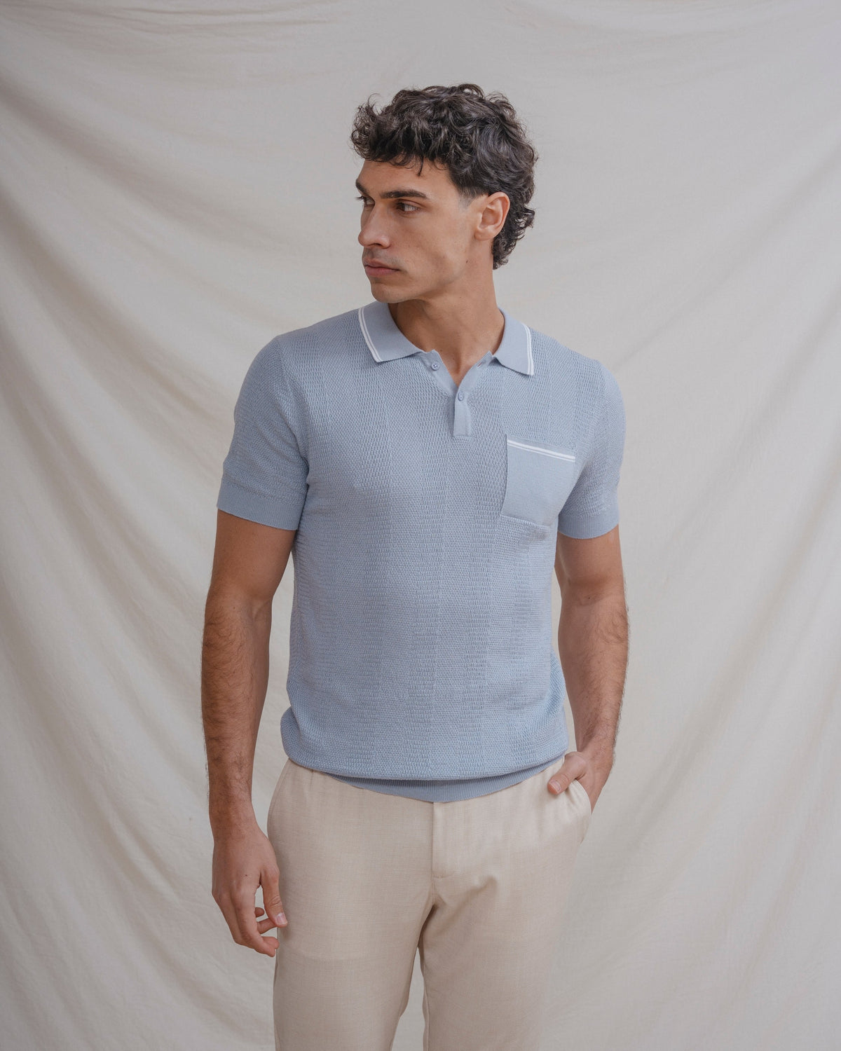 Polo tricot celeste de hombre · vista 1